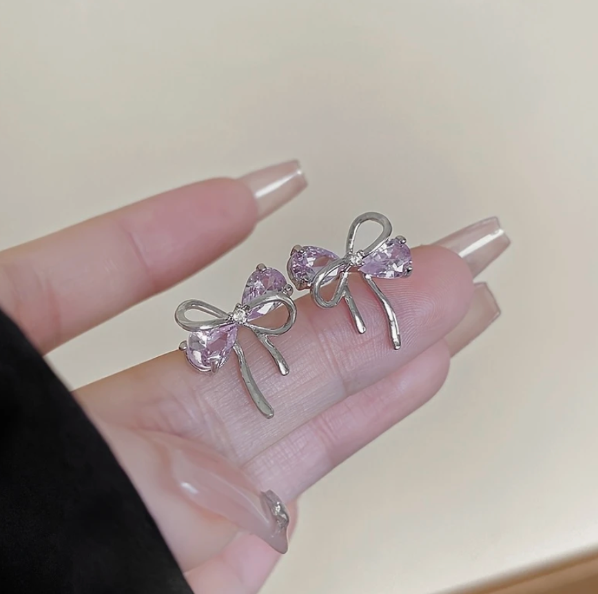Silver bow pink earring